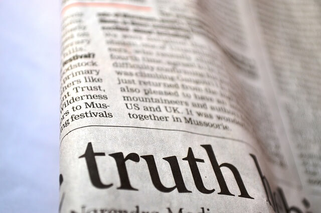 A newspaper page with the word "Truth" highlighted